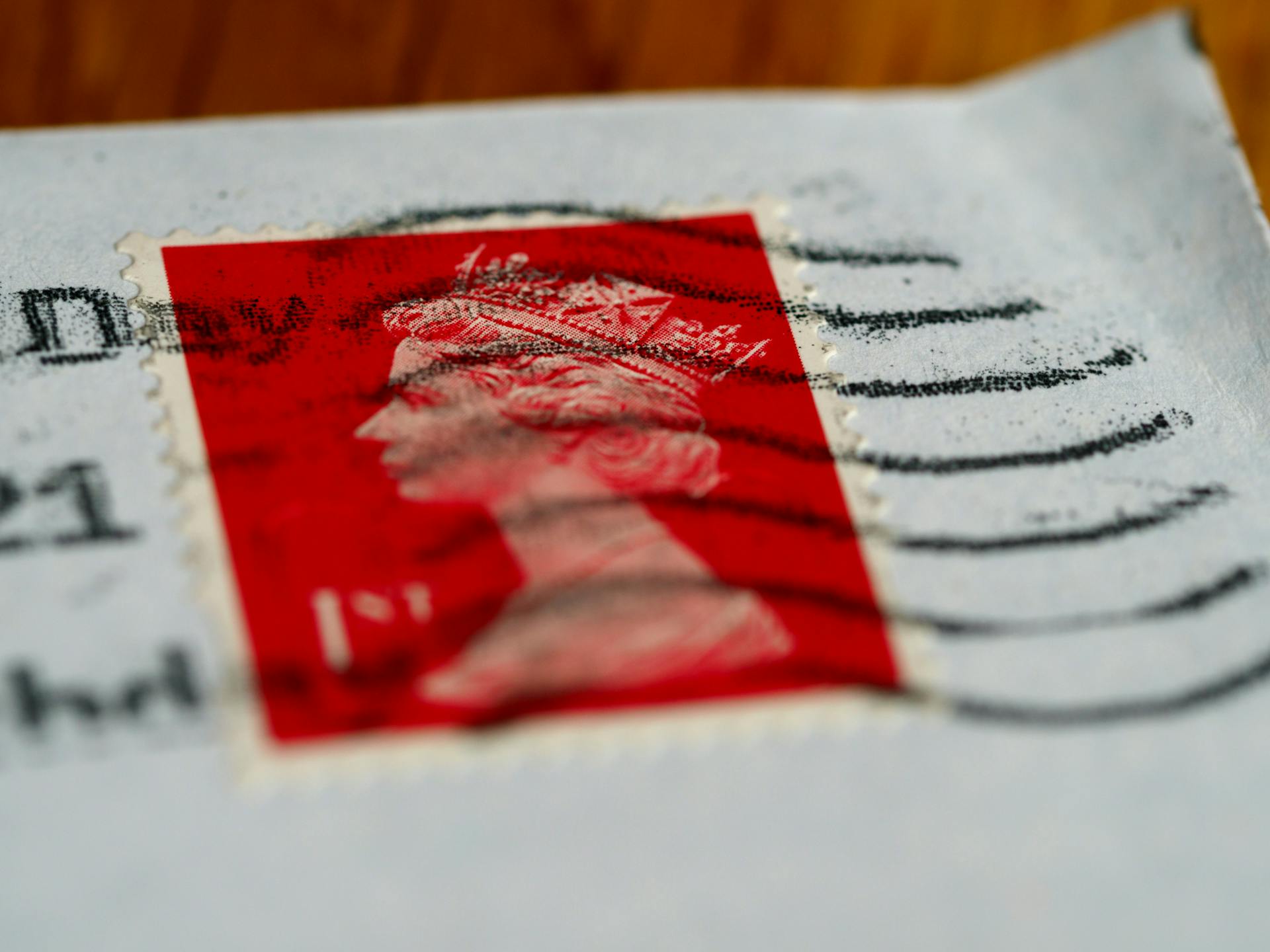 Close-Up Shot of a Red Postage Stamp