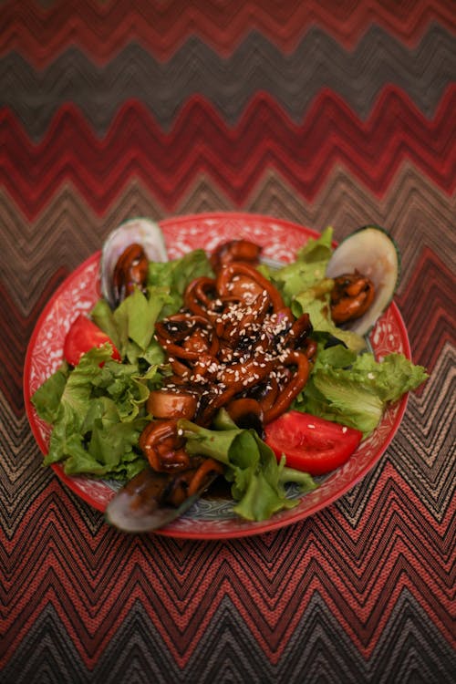 Cooked Food on Red Ceramic Plate