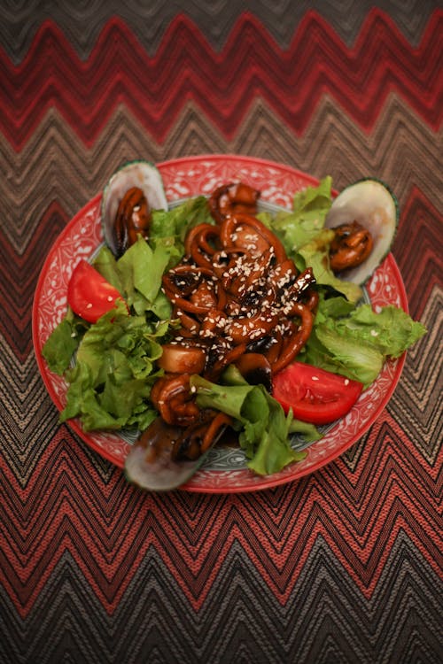 Cooked Food on Red Ceramic Plate