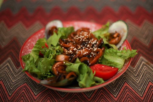 Cooked Food on Red Ceramic Bowl