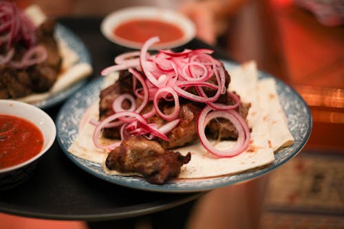 Close-up of Meat with Red Onion on Top 