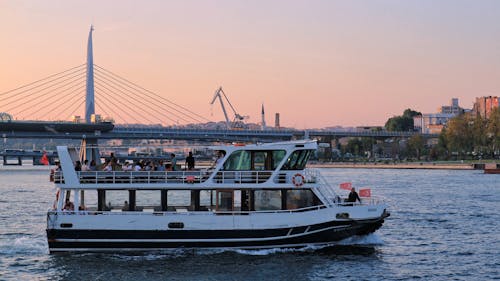 White and Black Ferry Boat on Water