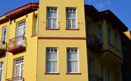 Free Yellow Building with Glass Windows Stock Photo