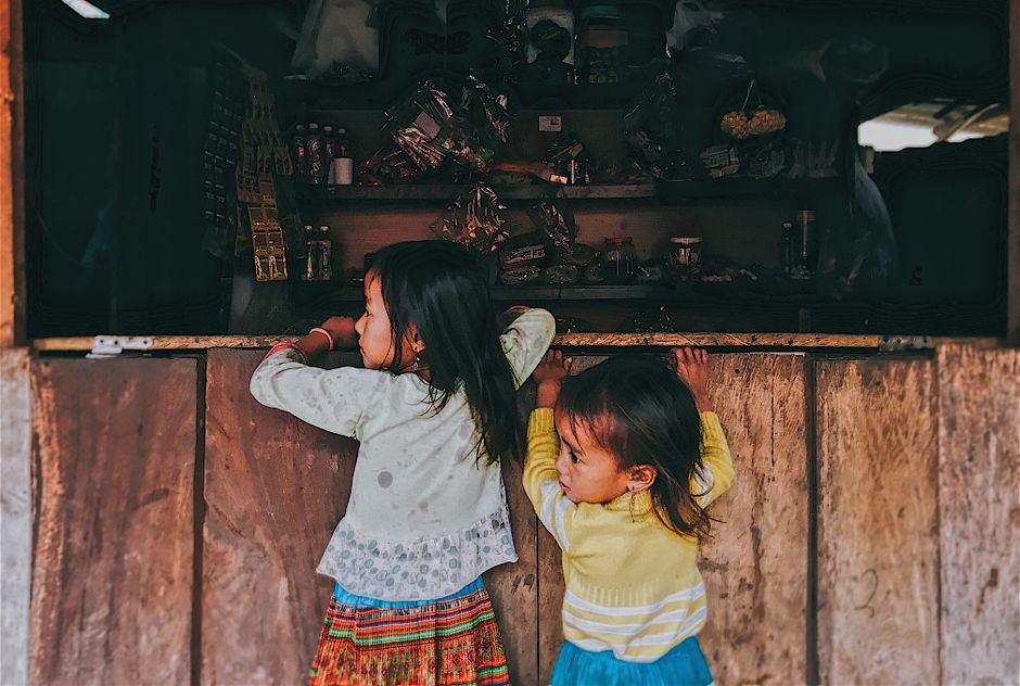 Two Toddler Girls in Front of Window