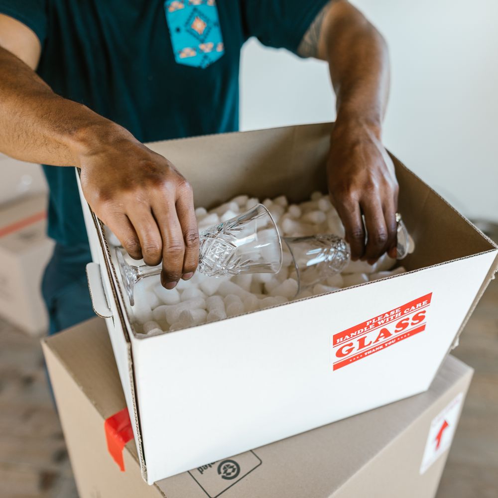 Long Ditton — professional packers wrapping and boxing belongings