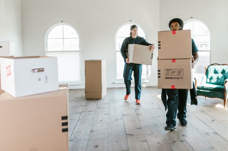 SwiftHaul Moving team carefully carrying boxes during a move in Philadelphia, Pennsylvania