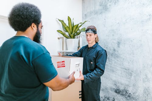 Close-Up Shot of a Man Delivering a Package