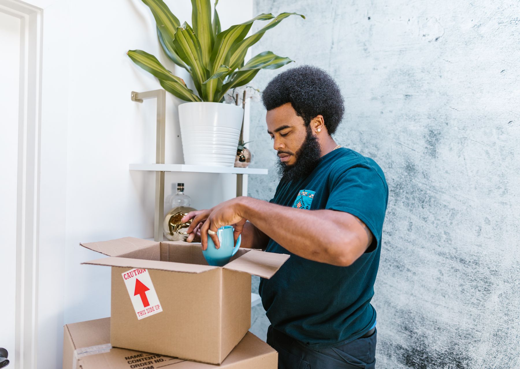Removals and storage in Silvertown — crew wrapping and loading on moving day