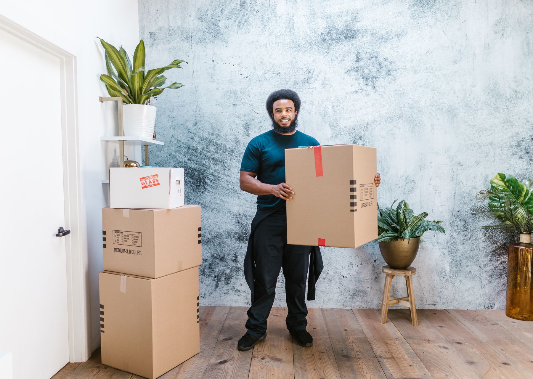 House removals in Arnold — crew wrapping and loading on moving day