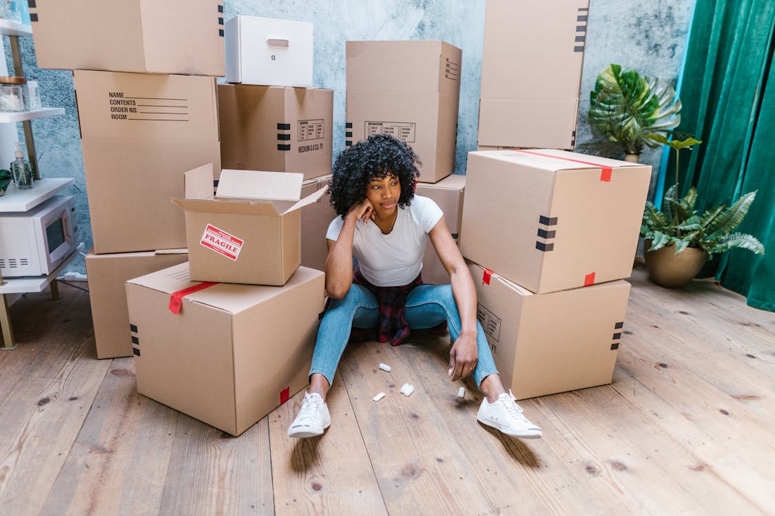 Woman sitting in cardboard box Stock Photo by ©Nomadsoul1 162005560