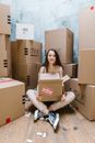 Woman Holding Cardboard Box