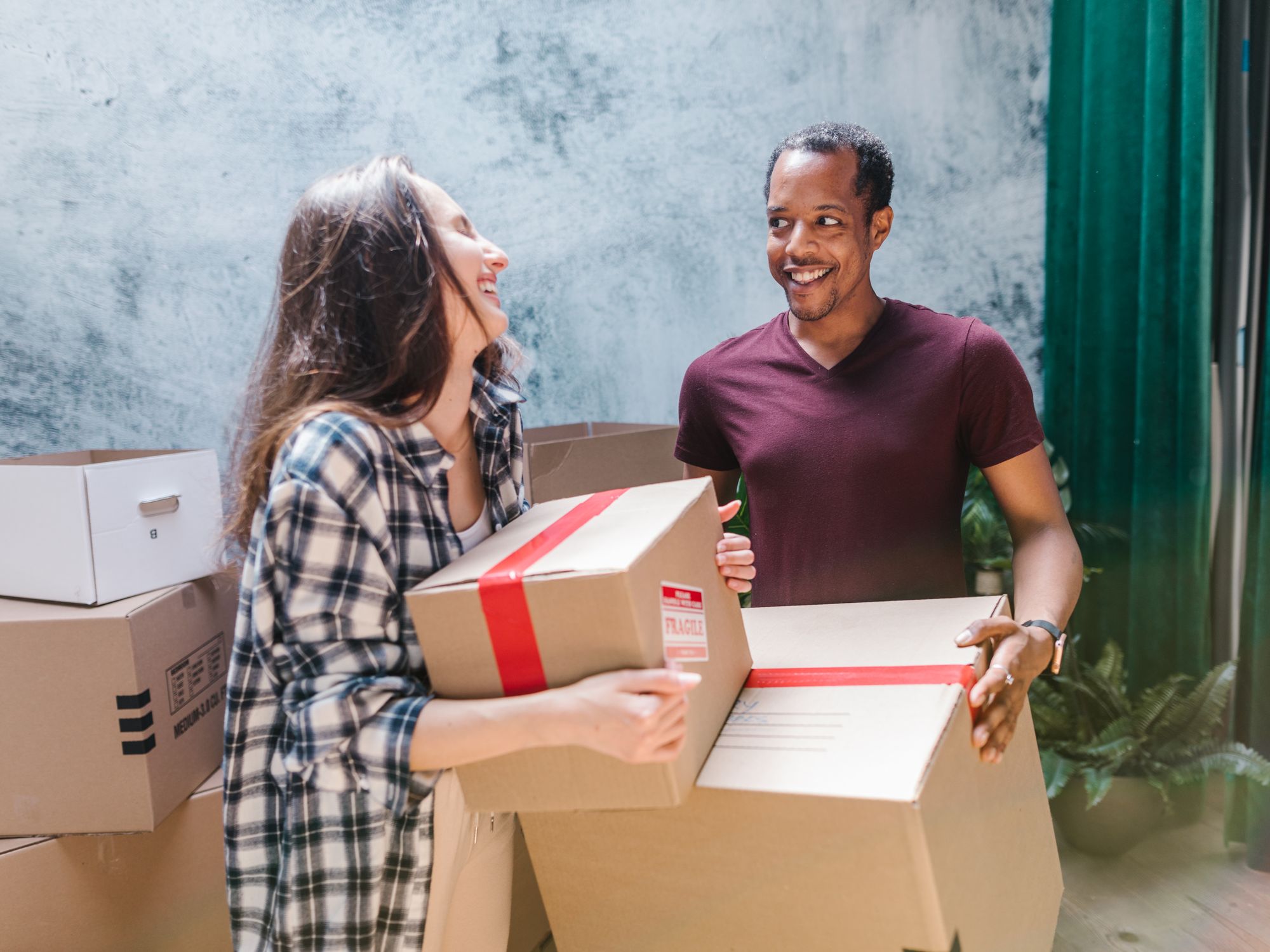 Flat Removals in Stanwick, East Midlands — movers carrying boxes for a flat move