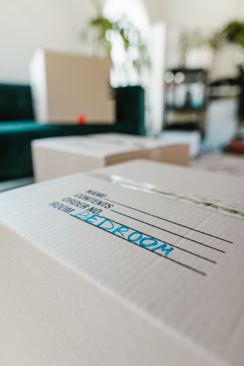 Packed moving boxes stacked and labelled by VIP House Movers ready for transport