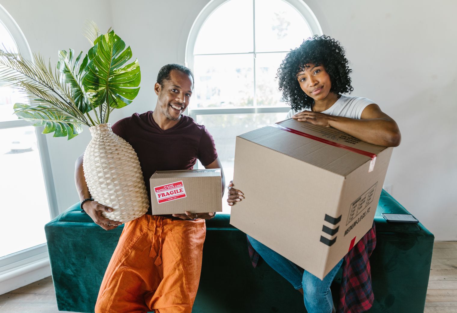 Locking — professional packers wrapping and boxing belongings