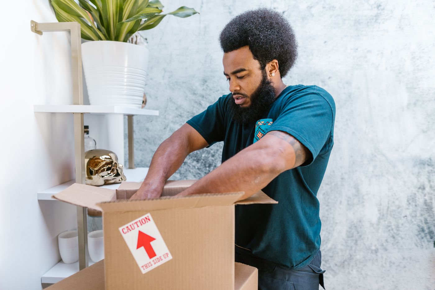 Carefully wrapping fragile items for a move