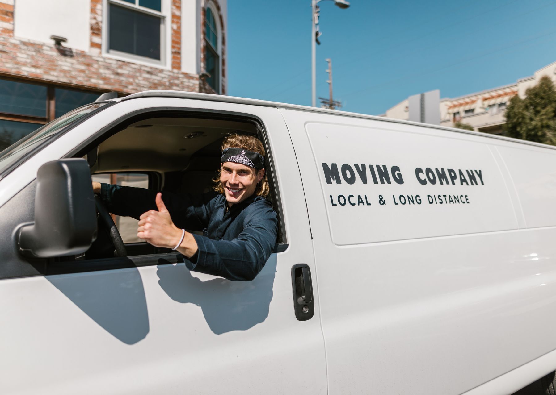 Flat removals in Longside — crew wrapping and loading on moving day