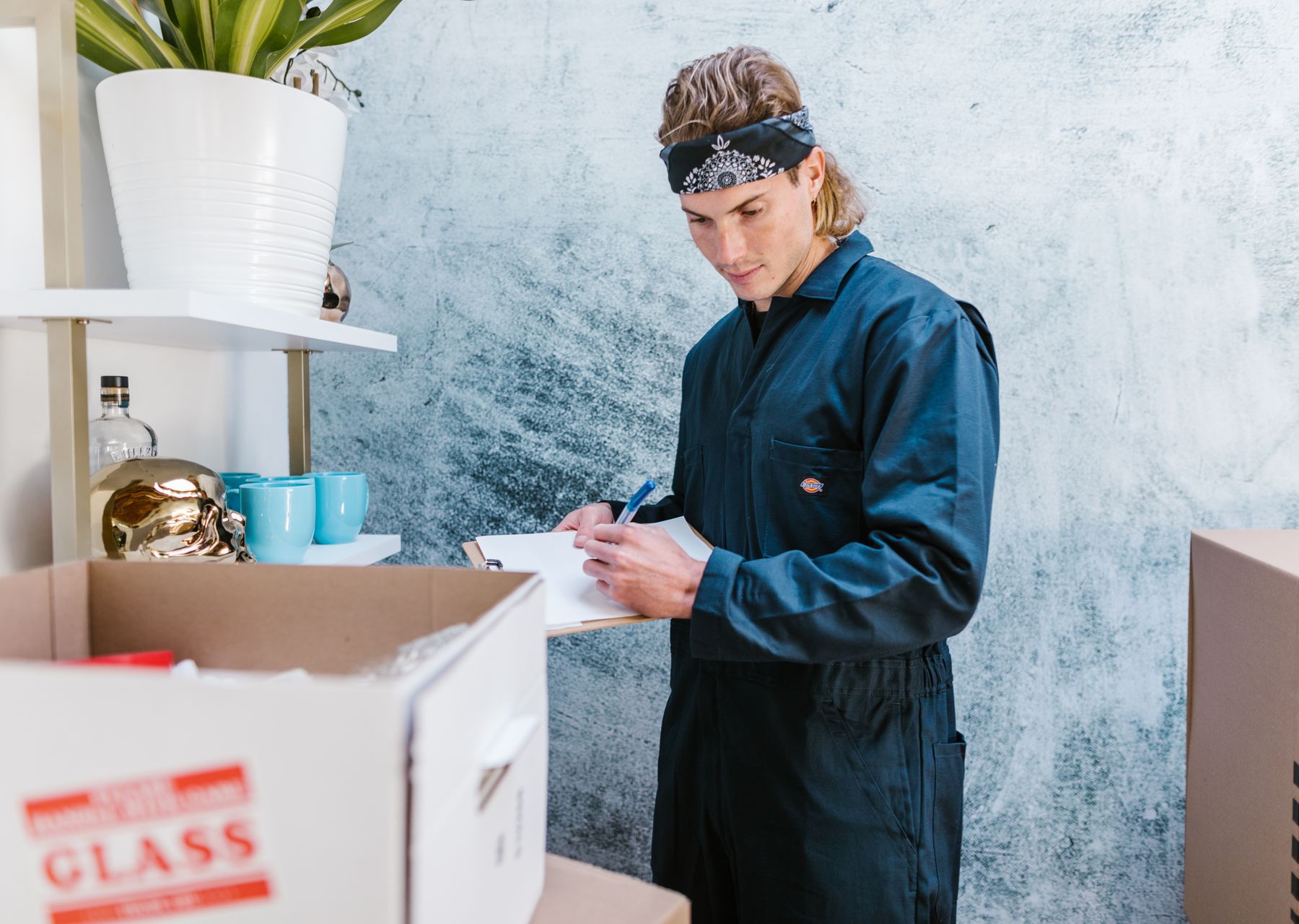 Removals and storage in Crossness — crew wrapping and loading on moving day