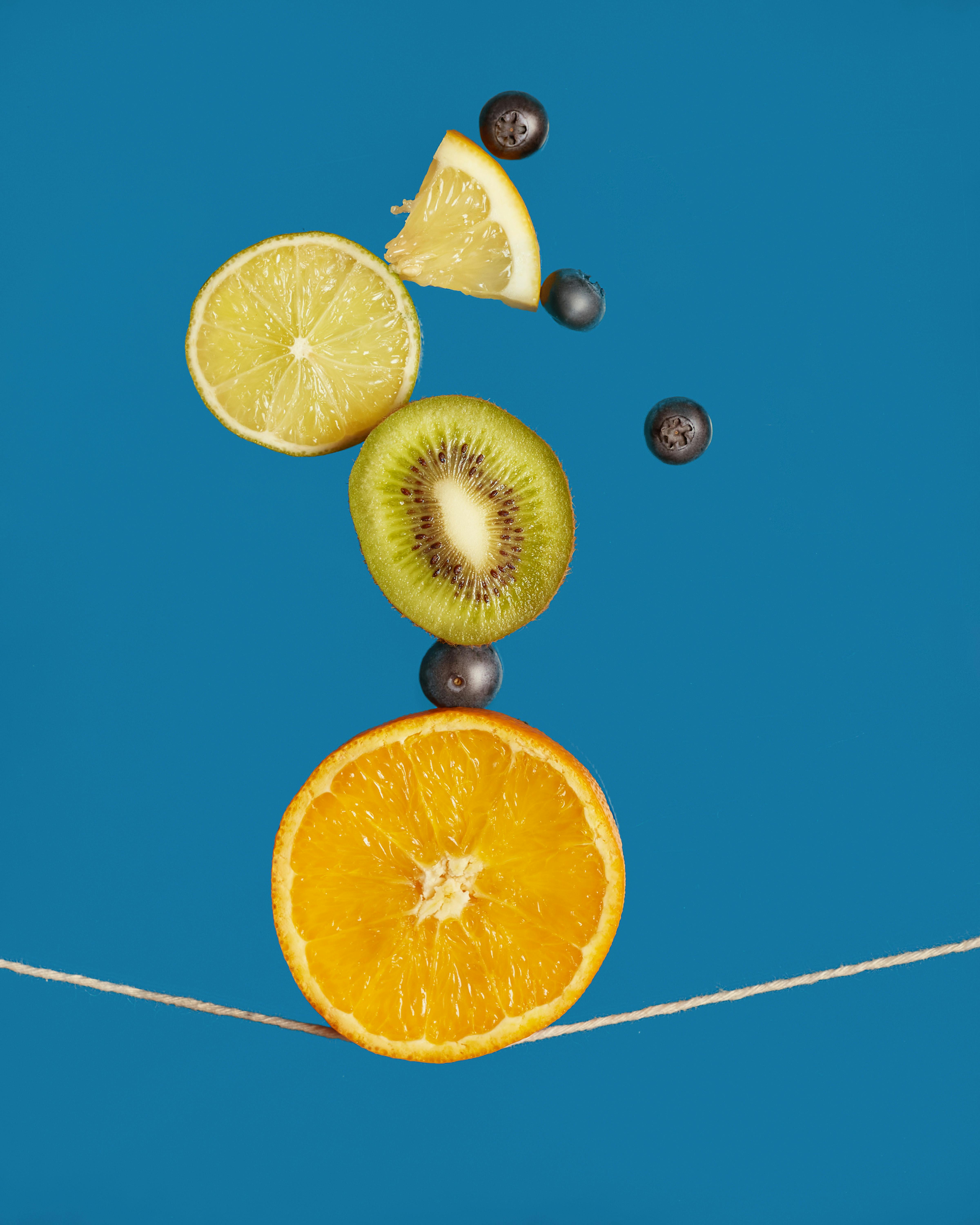 Woman in Underwear Bent Over with Fruits on the Floor Free Stock