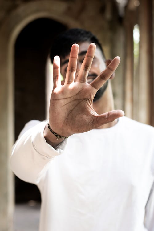 Close-Up Shot of a Man in White Long Sleeve