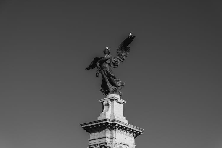 Black Stone Statue Of Angel On Pedestal