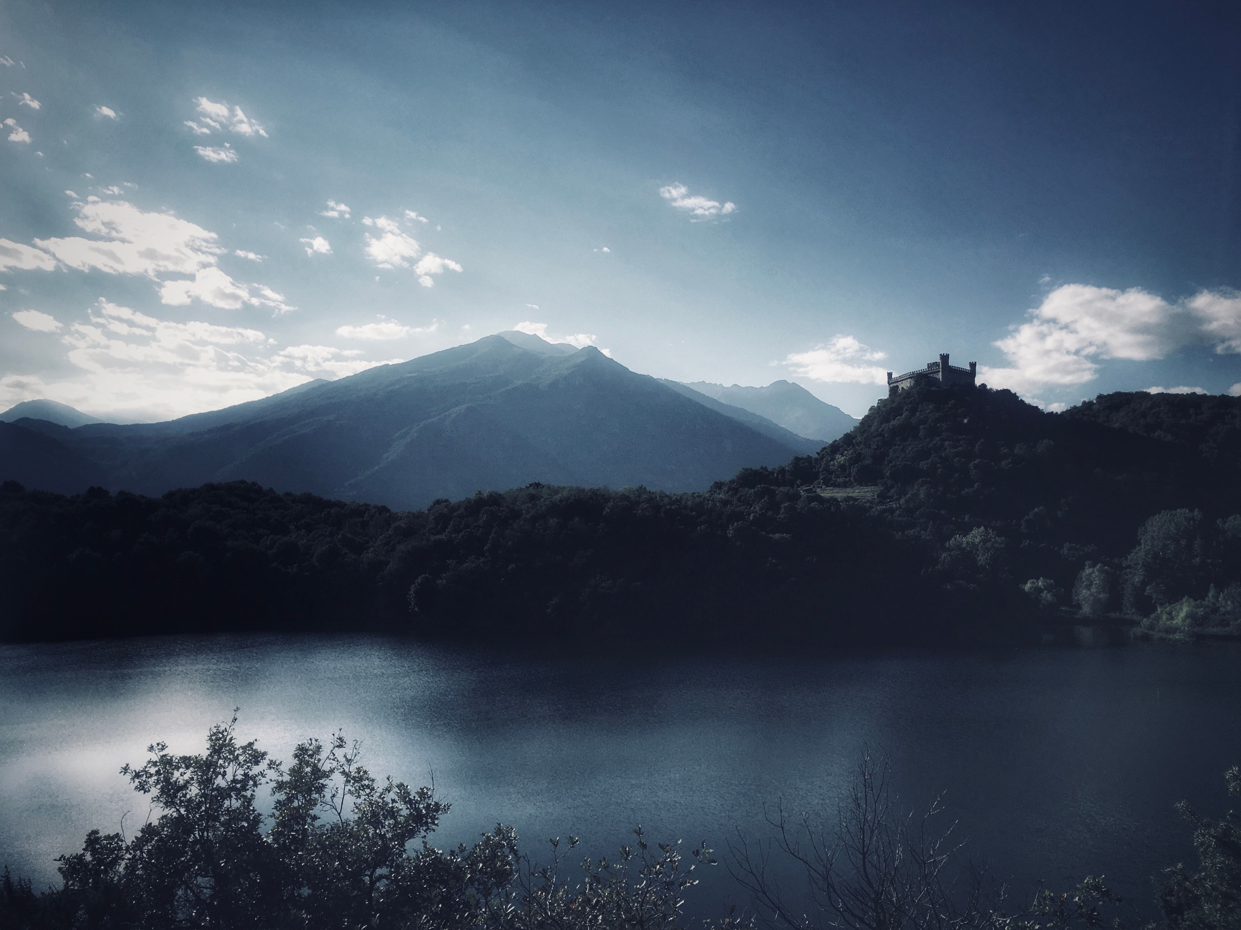 Lake Near Mountain Under Blue Sky · Free Stock Photo