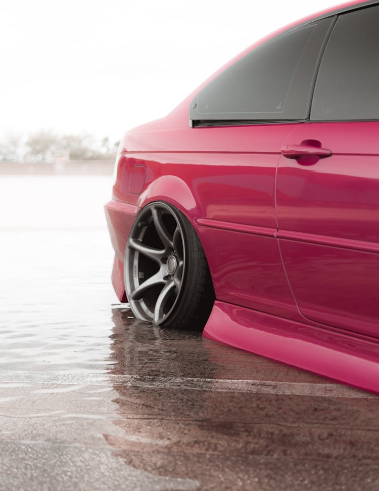 Pink Car With Flat Tire During Flooding