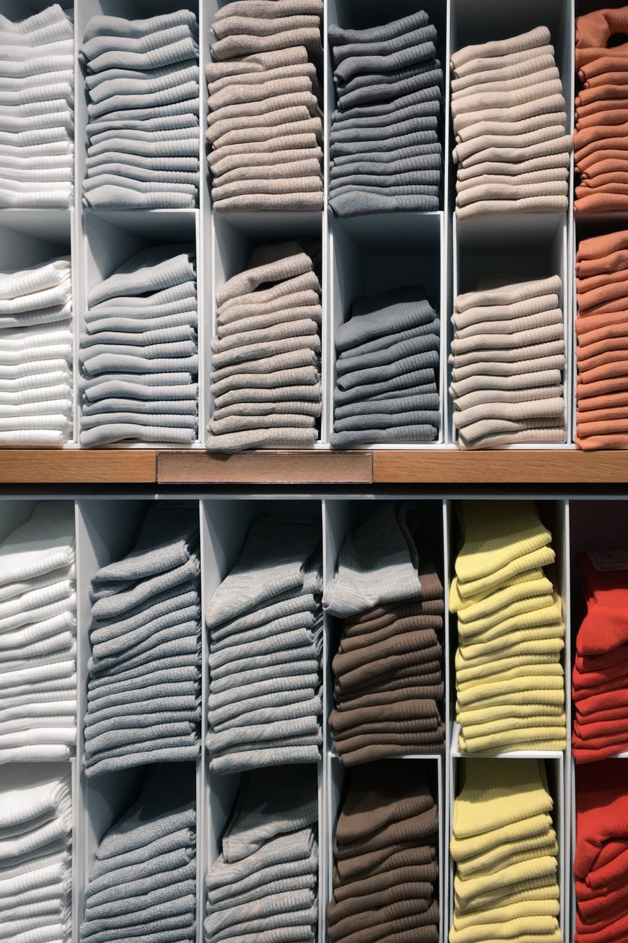 Shelves of folded towels for wholesale supply
