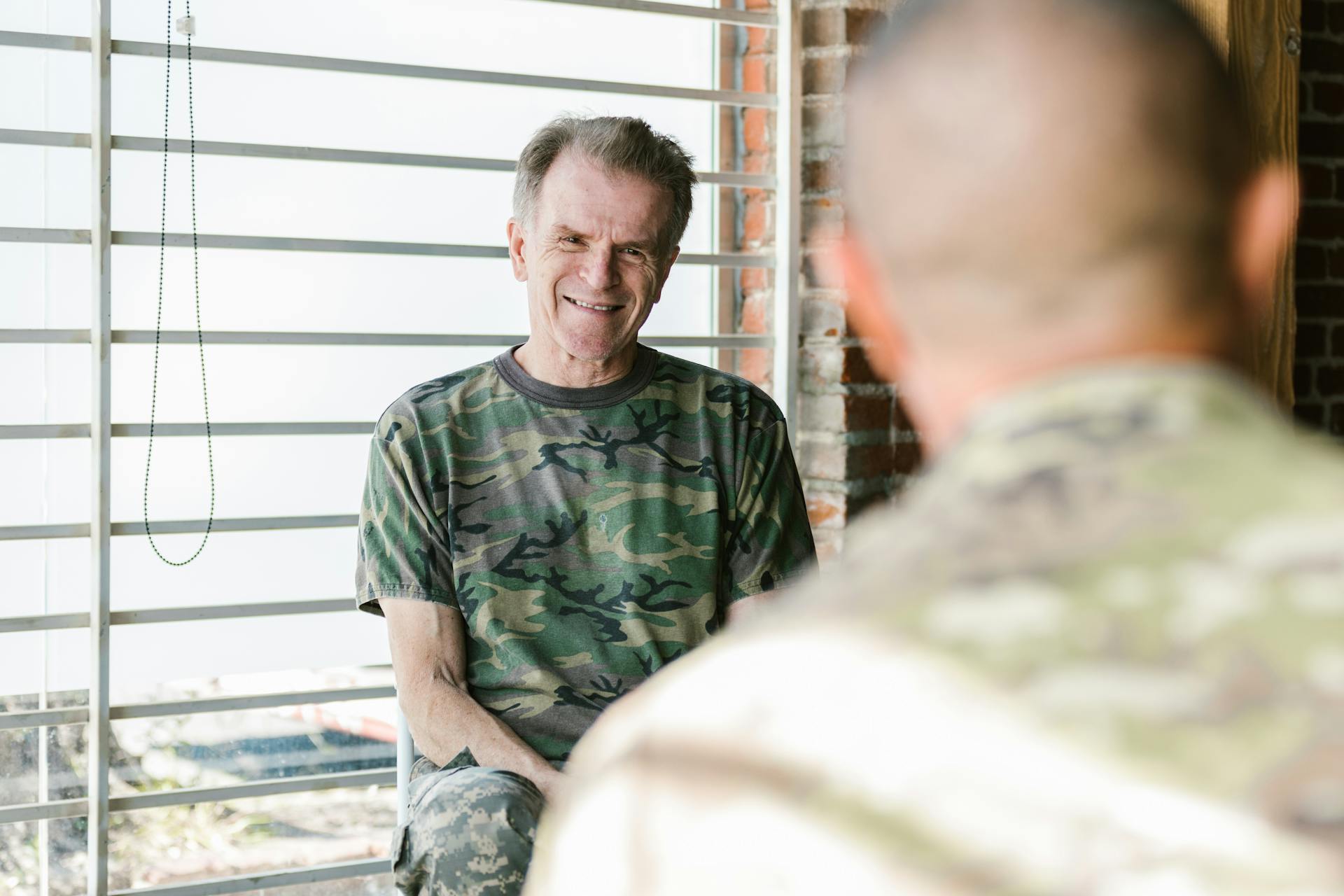 Photo of Veteran Sitting Beside Wndow