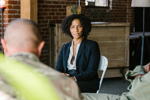 Free Photo of Psychologist Talking to Soldiers Stock Photo