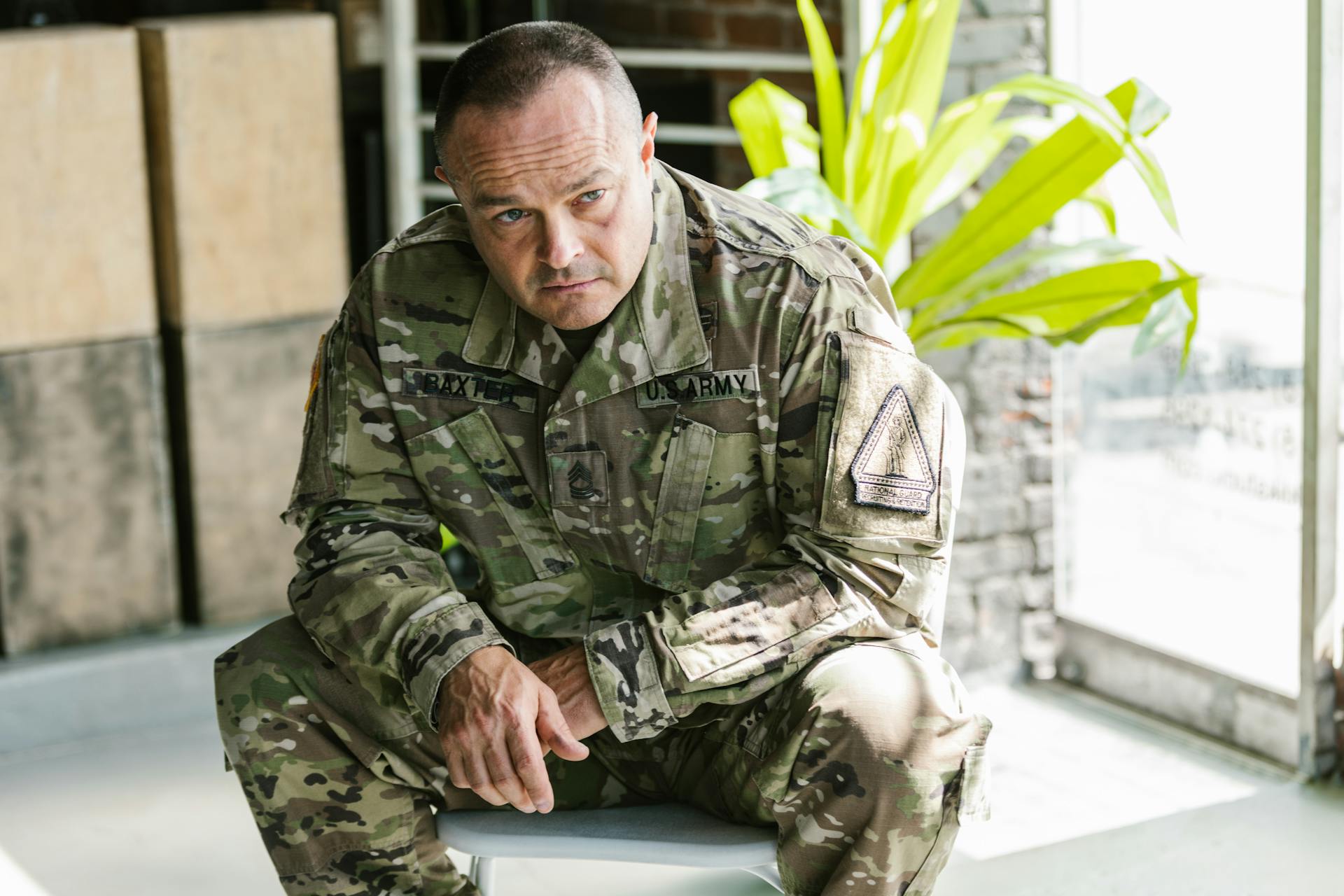 Photo of Man in Brown and Green Camouflage Military Uniform