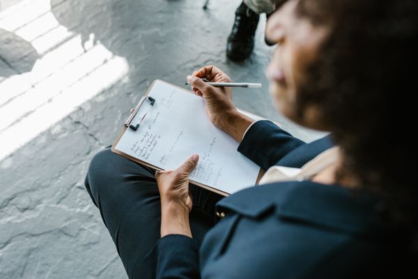 Therapist taking notes during session