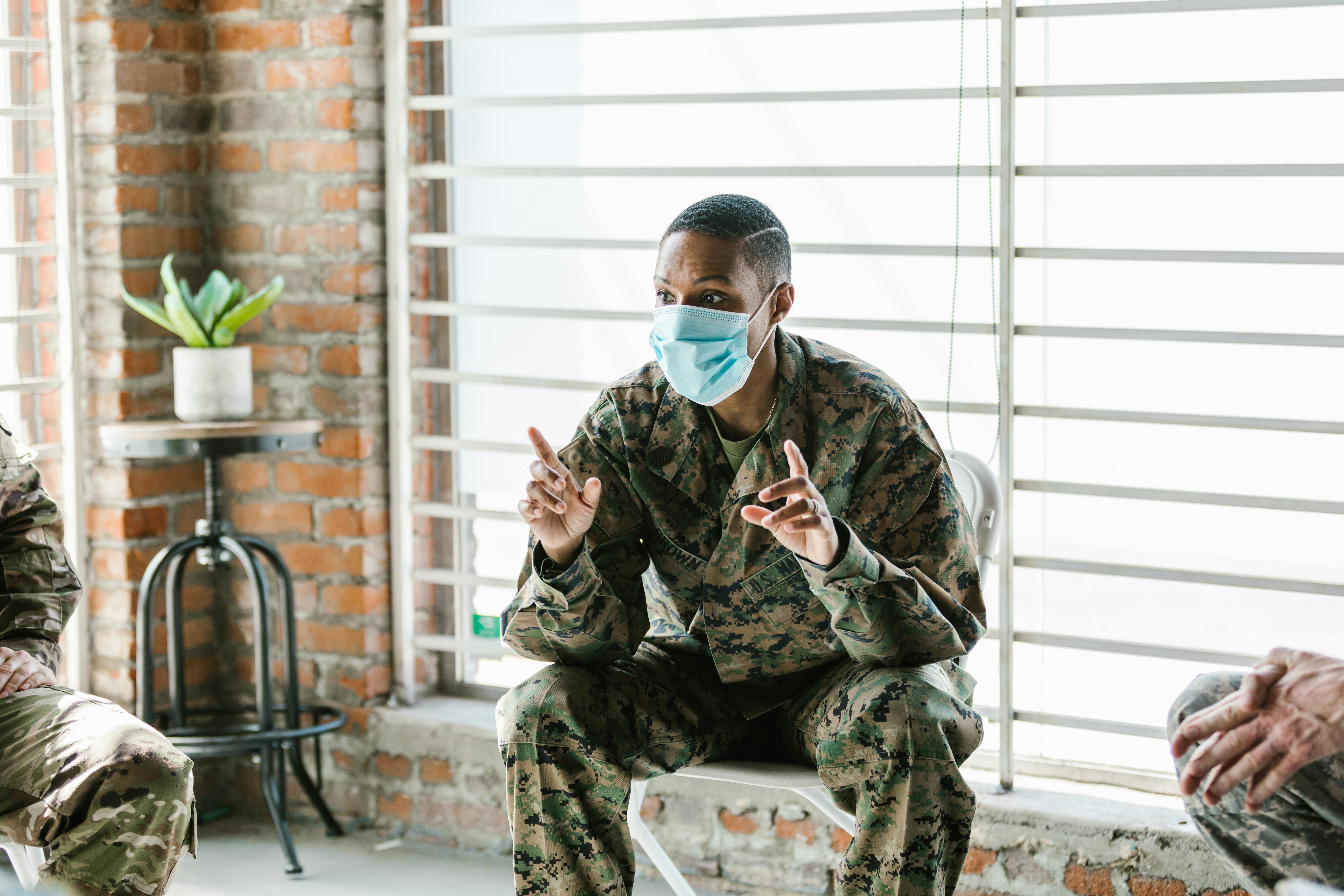 photo of soldier talking with his facemask on