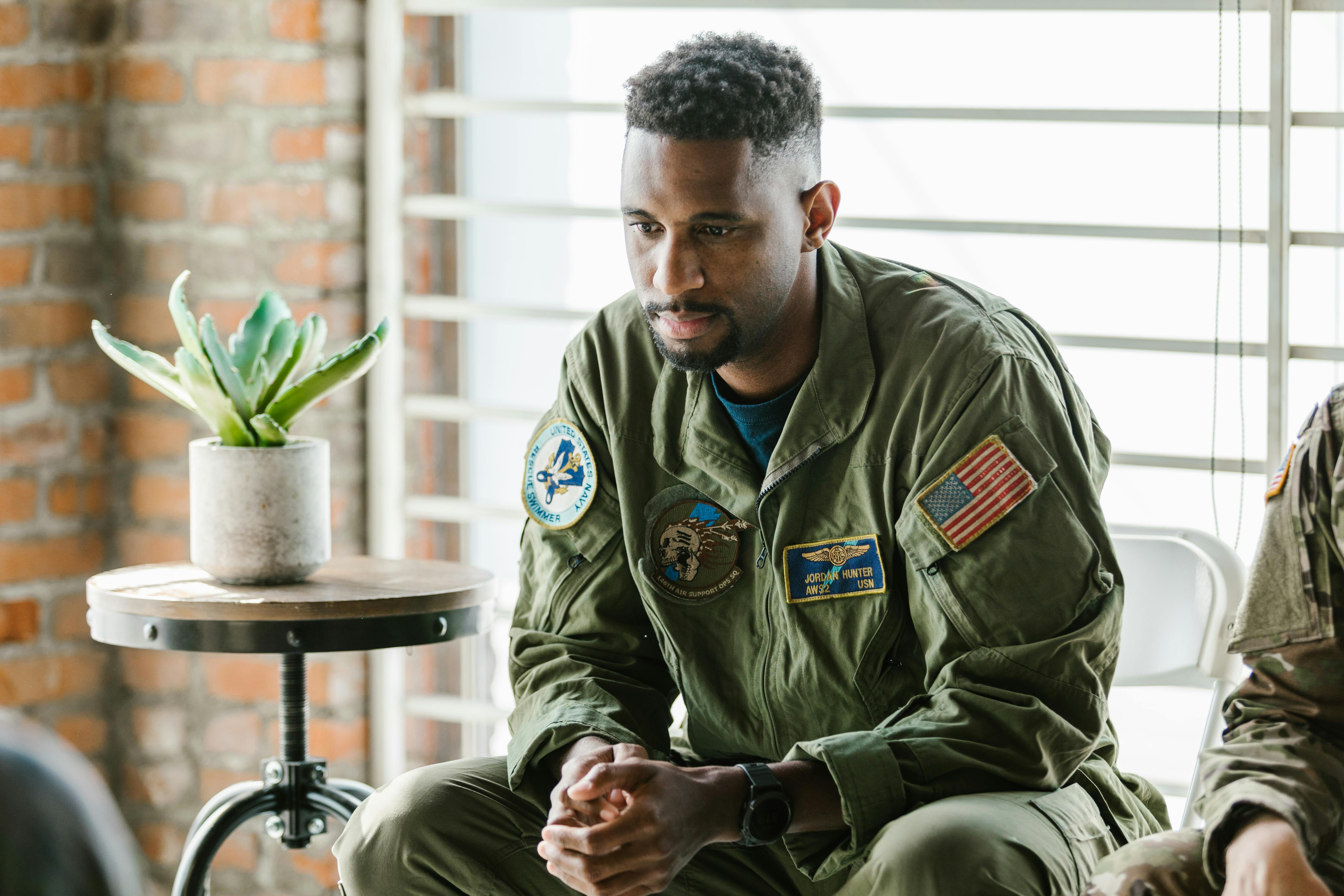 photo of soldier wearing green military uniform