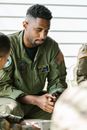 Photo of Soldier Praying with his Comrades