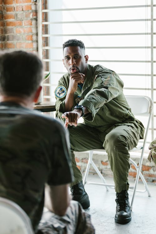 Free Photo of Soldier Talking to his Comrade Stock Photo