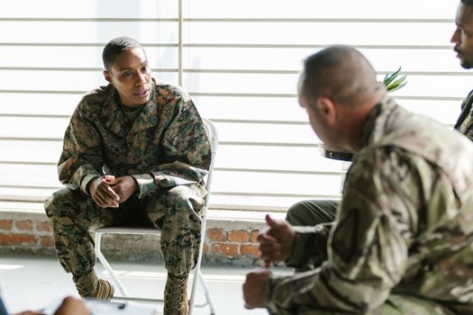 Photo of Soldier Actively Listening to her Comrade