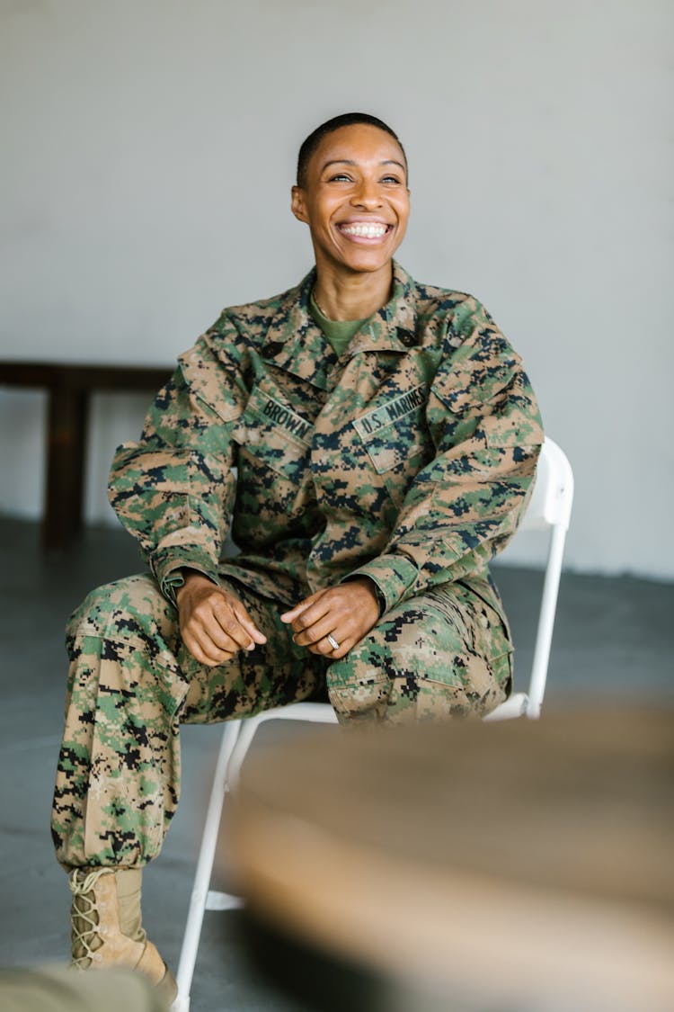 Photo Of Soldier Sitting On A Folding Chair