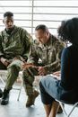 Photo of Soldier Looking Down while Talking