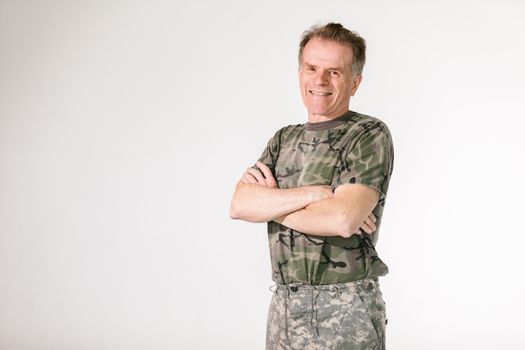 senior veteran smiling in living room