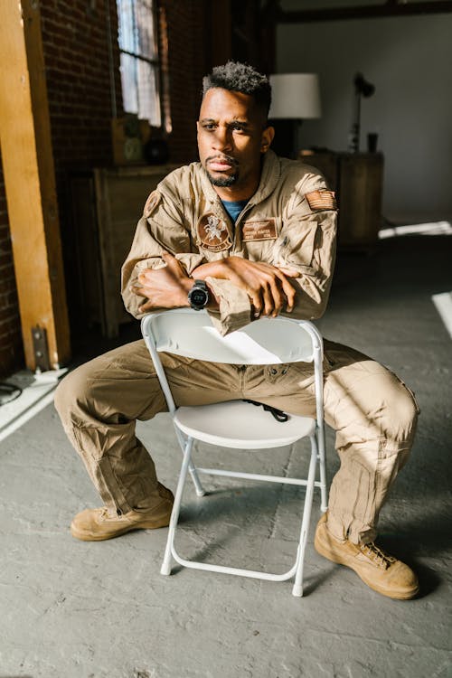 Photo of Soldiers Sitting on Folding Chairs · Free Stock Photo