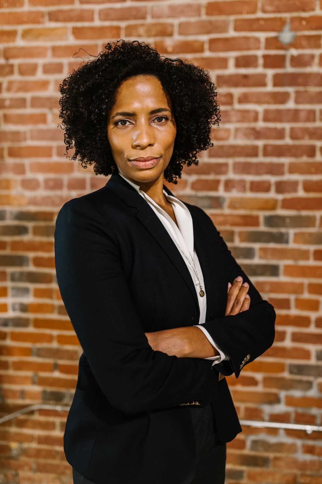 An attorney standing in the firm's office