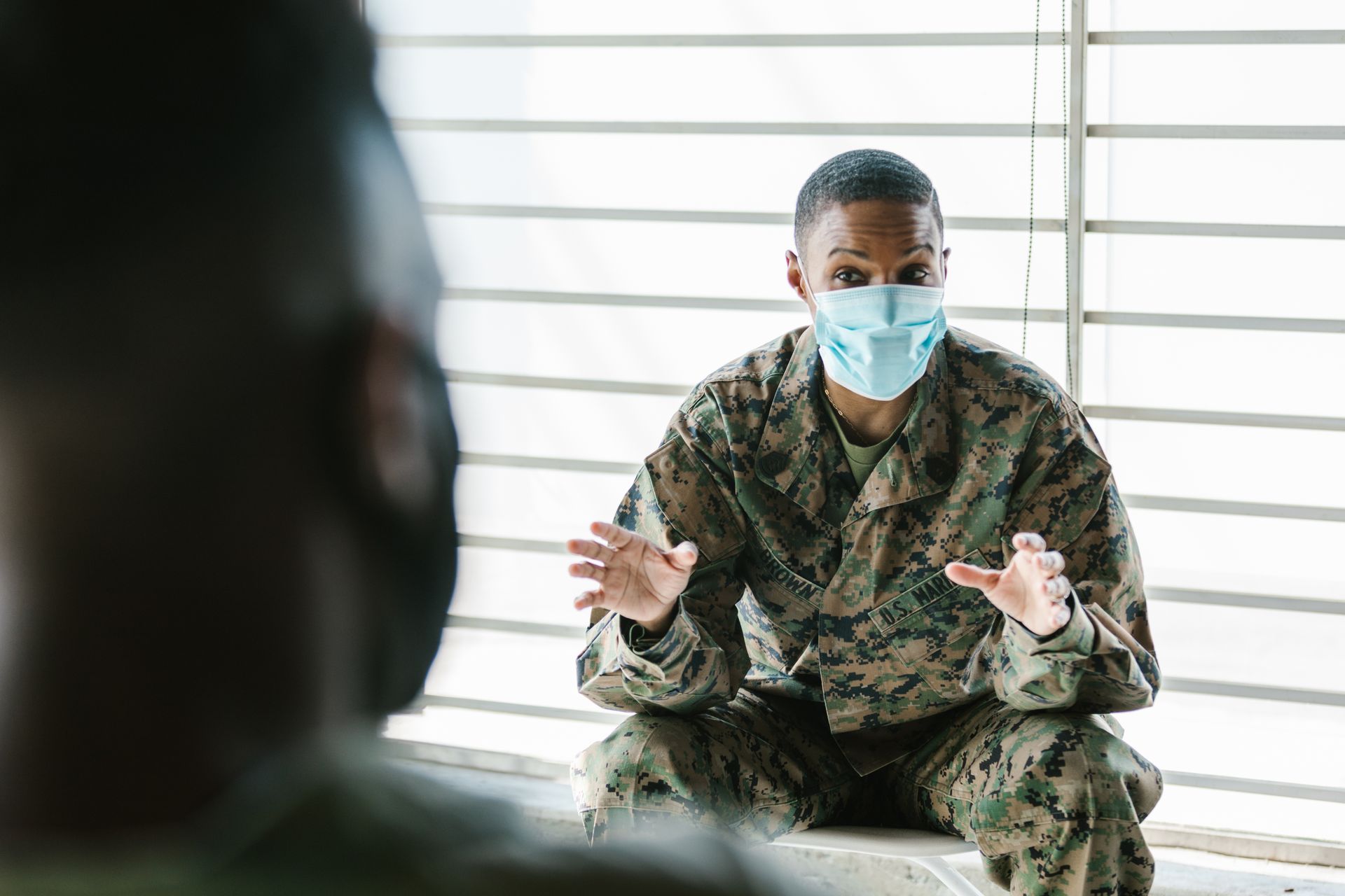 Photo of Soldier Talking to his Team Mate