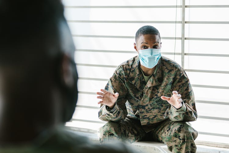 Photo Of Soldier Talking To His Team Mate