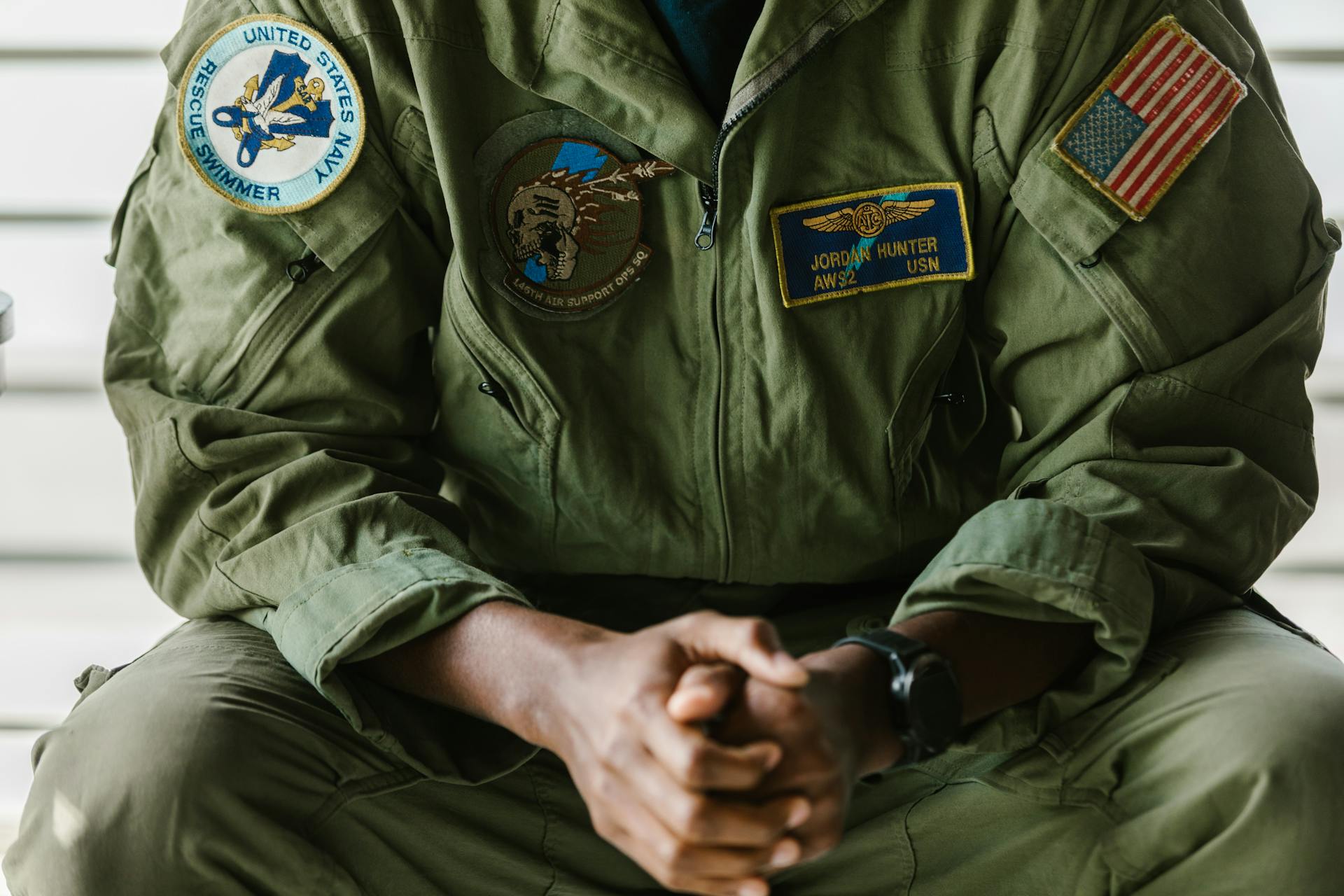 Close-Up Photo of Man Wearing Military Uniform with Badges