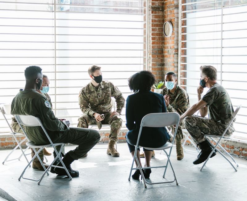 A group therapy session utilizing digital tools for emotional support