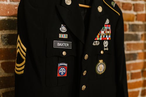 Close-Up Photo of Navy Uniform with Gold Medals · Free Stock Photo