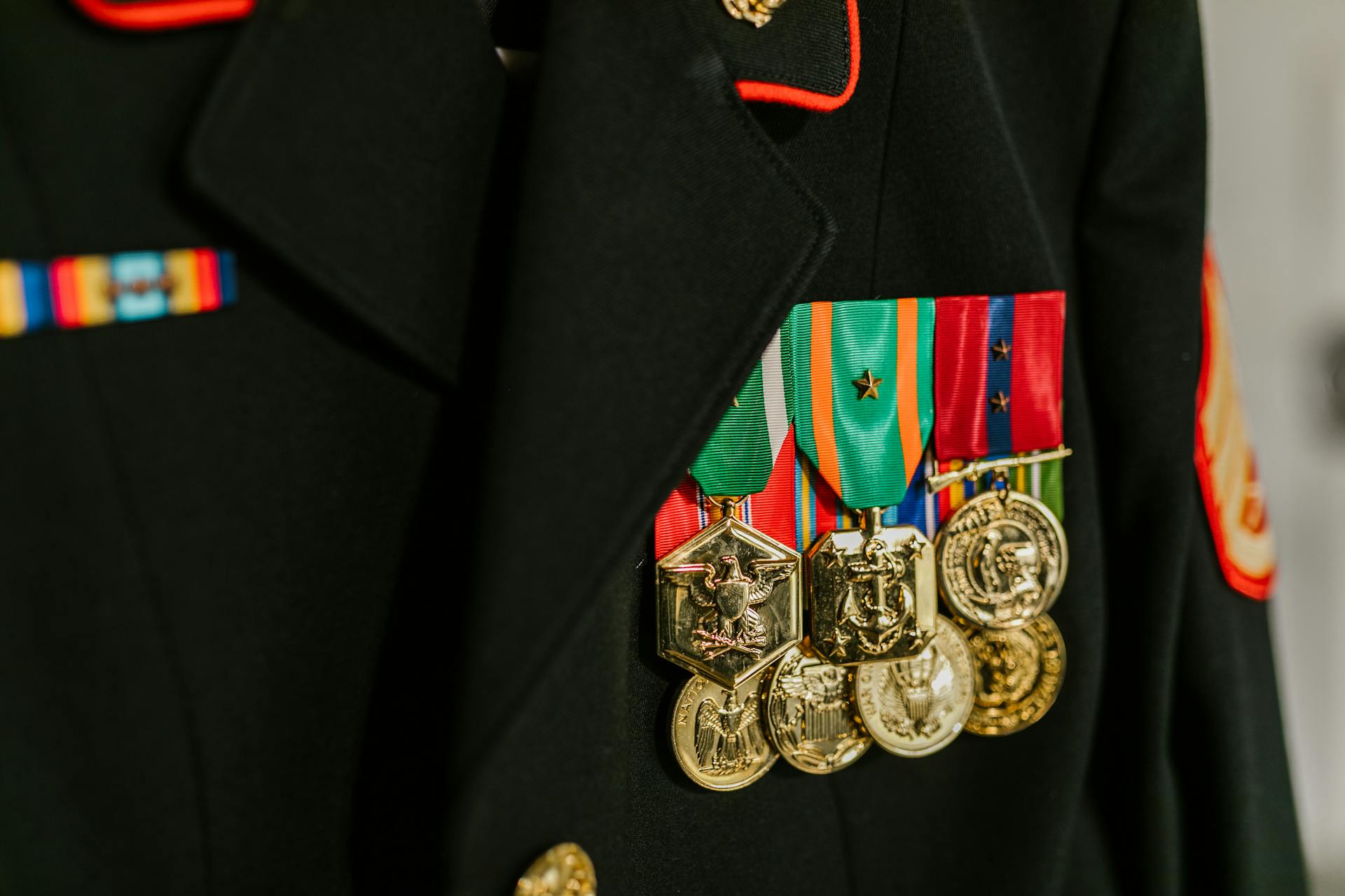 Close-Up Photo of Navy Uniform with Gold Medals