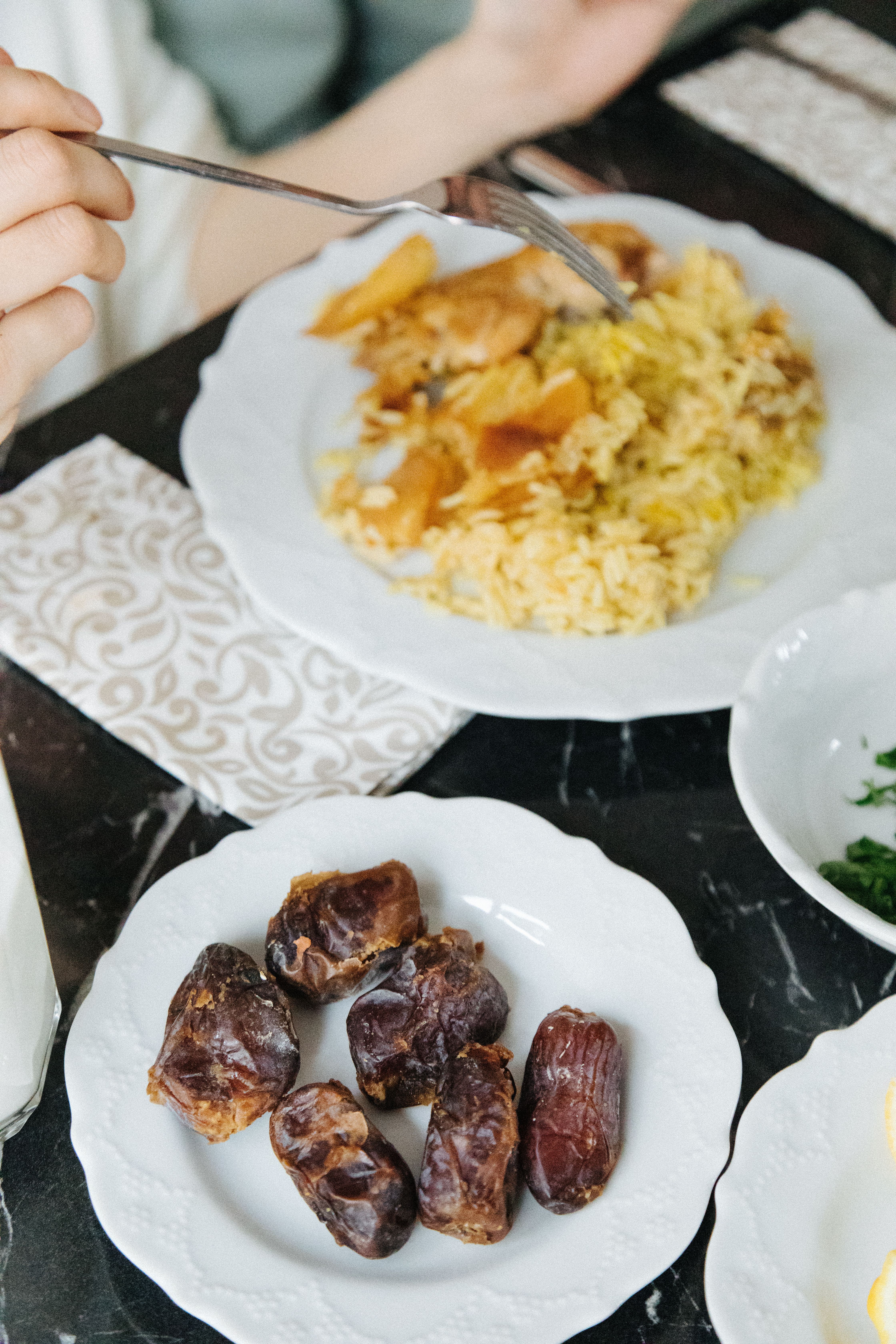 Close-up of dates and rice on a table in Istanbul, showcasing Middle Eastern cuisine.