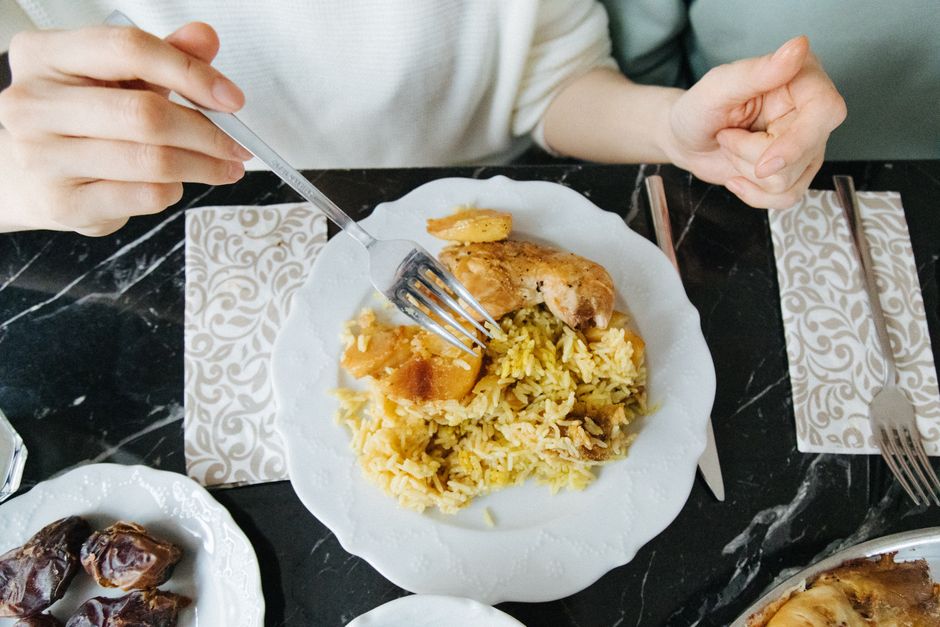 A large platter of Mansaf, Jordan's national dish, with rice, lamb, and jameed