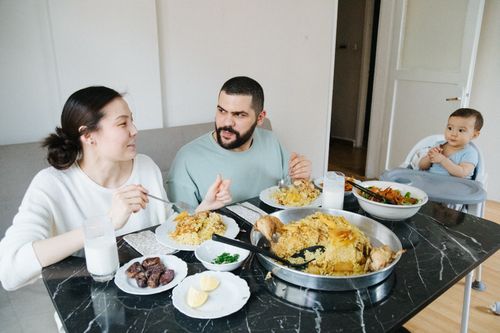 Free A family sharing a meal at home, highlighting connection and togetherness. Stock Photo